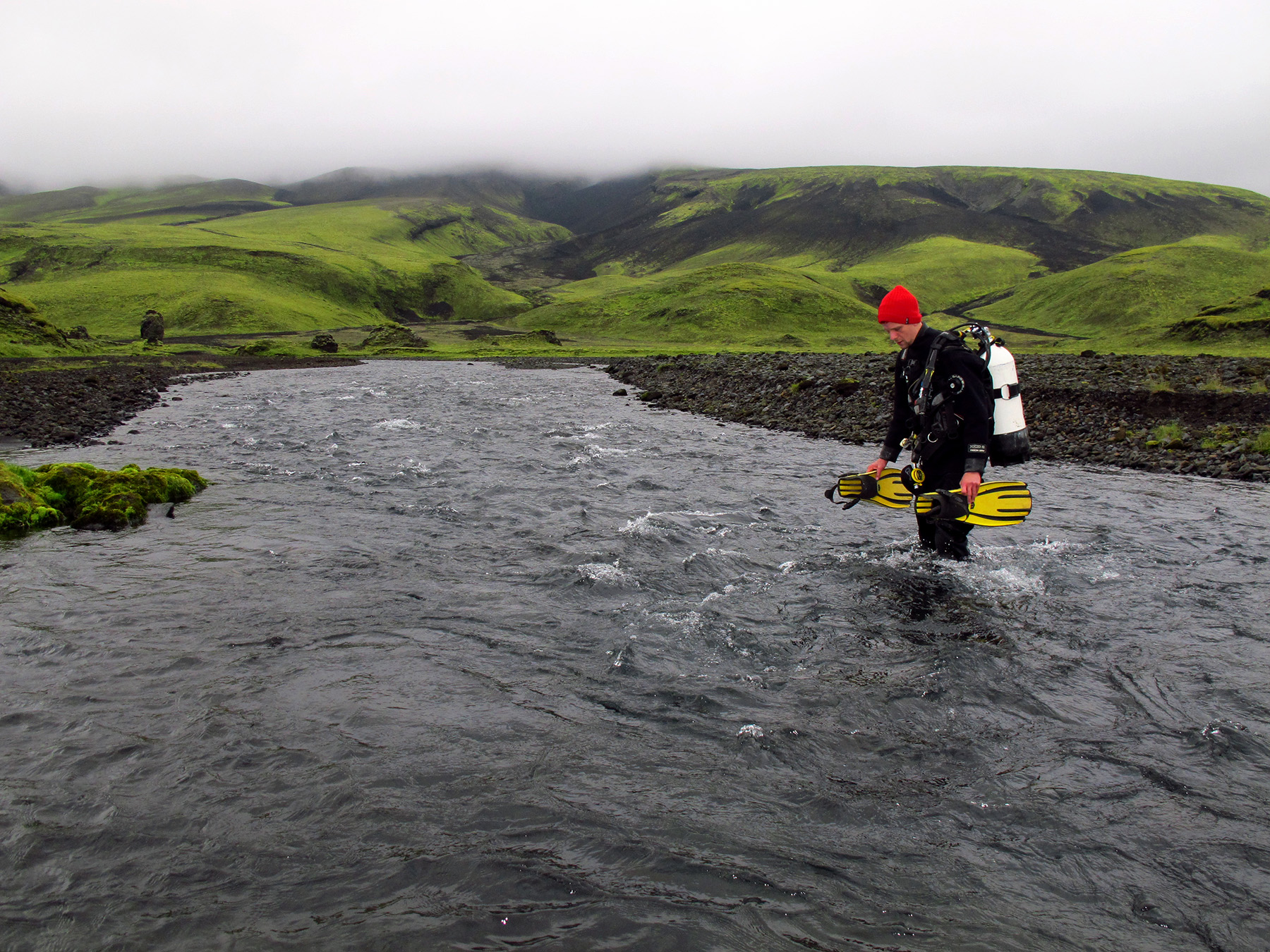 Diver crossing a river on his way to the Tear of Odin