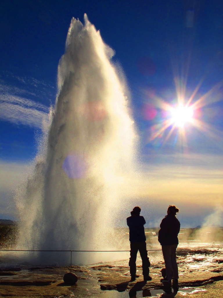 Strokkur with the sun in the background