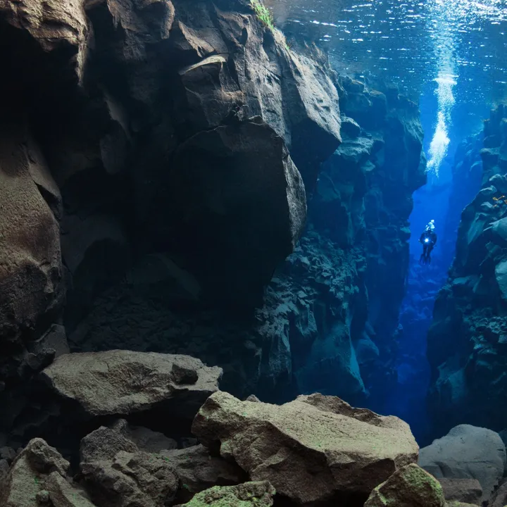 Diver descending into Silfra, Thingvellir