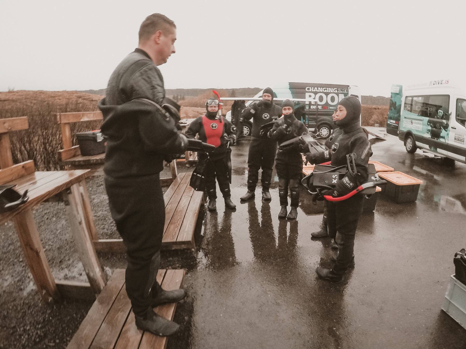 Snorkel guide Deyan dressing into his Dry Suit deyan-dressing-into-his-dry-suit