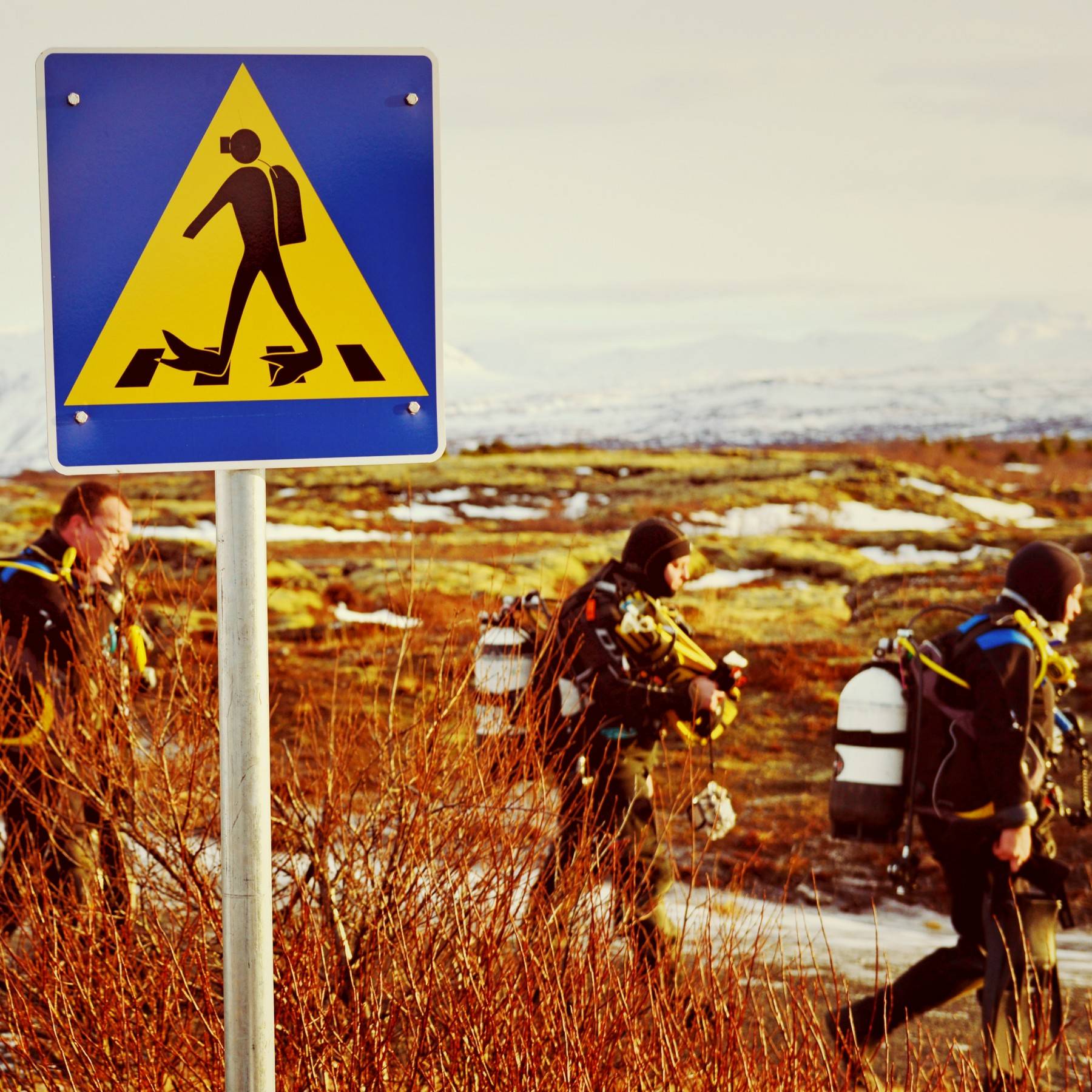Diver Crossing Traffic Sign at Silfra, Iceland Diver Crossing Traffic Sign at Silfra, Iceland