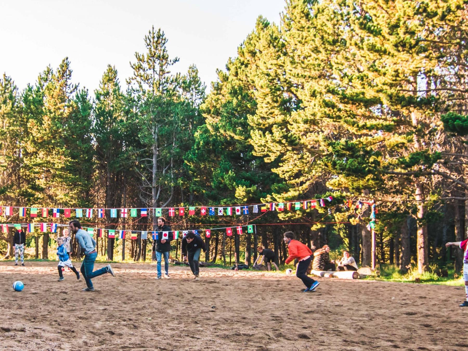 Our staff members playing soccer with the kids playing-games-at-staff-bbq-dive-is