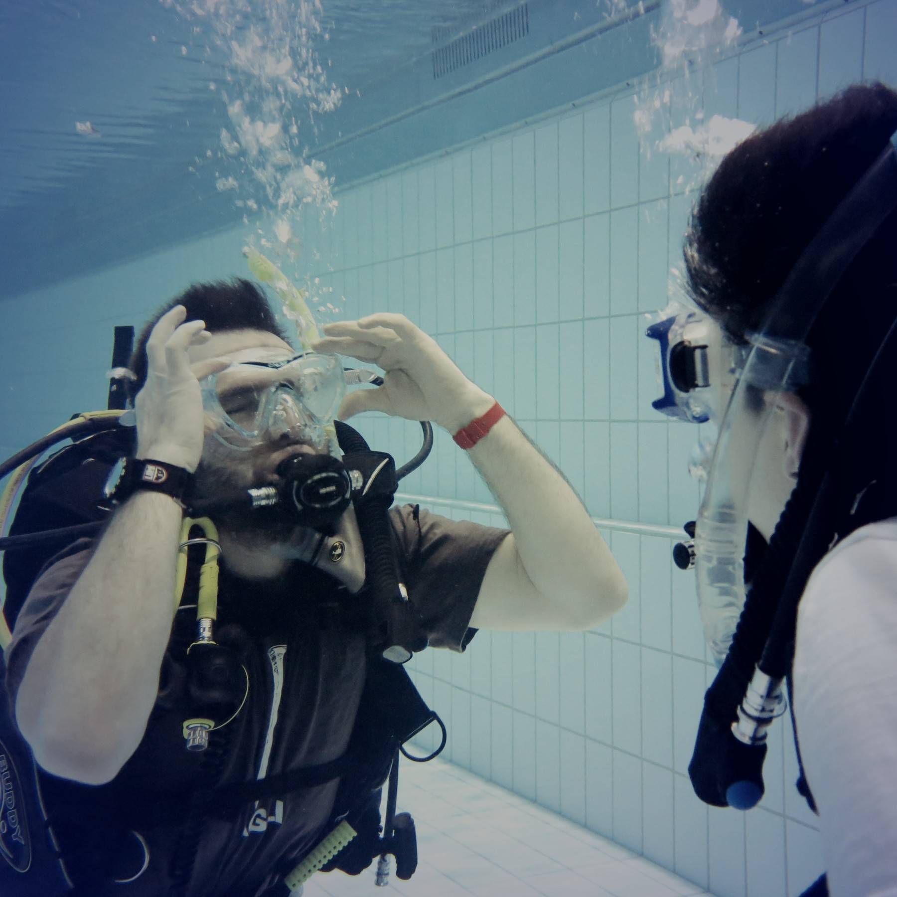 Instructor Jammi teaches a student during one of the pool sessions of the PADI Open Water Diver Course in Reykjavík, Iceland