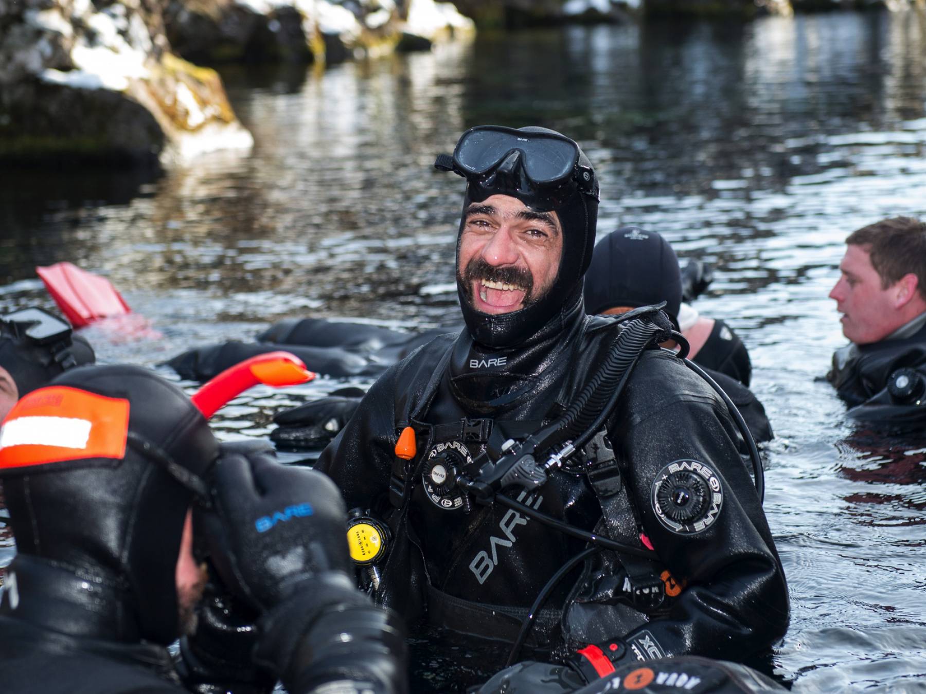Diver laughing at Silfra entrance laughing-diver-at-silfra-entrance