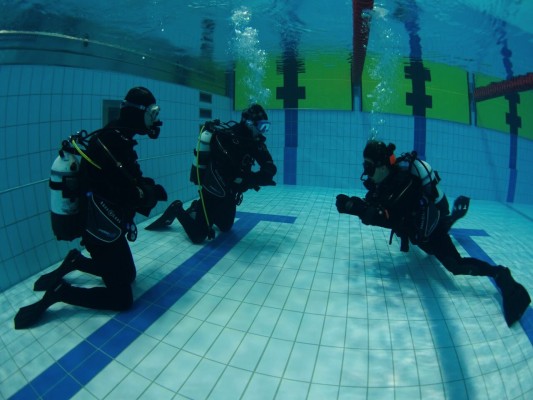 Dry Suit Course students doing skills in the pool with their instructor