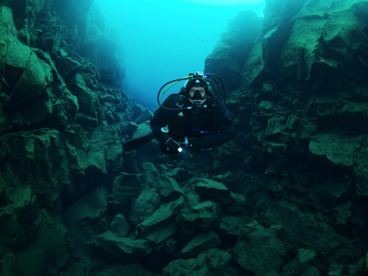 Scuba diver in Davidsgja fissure