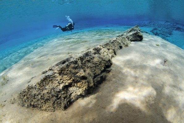 Scuba diver in endless visability in Silfra fissure in Iceland