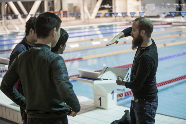 Dry suit students during pool session with their instructor