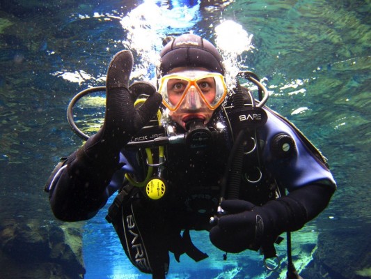 Happy dry suit student on his ocean dive
