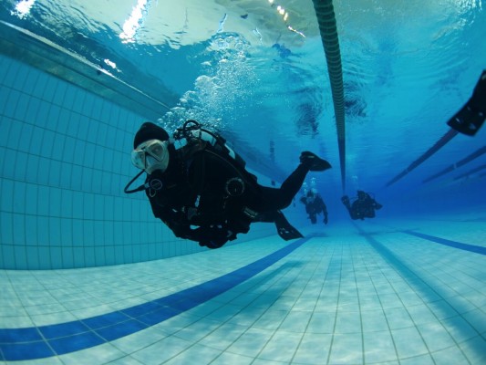 Diver doing pool session on his dry suit course