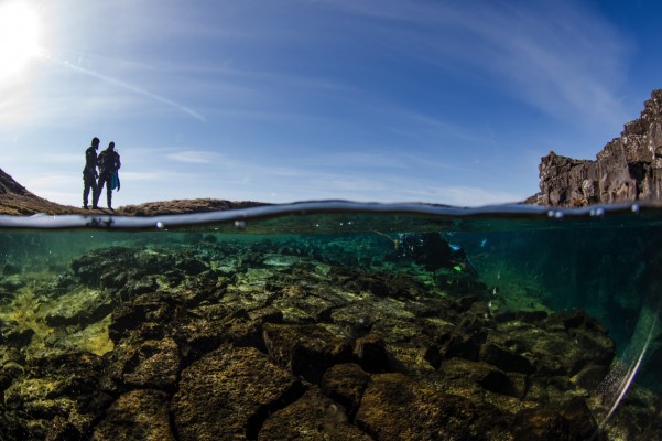 Divers at Bjarnagja rift in Reykjanes Iceland