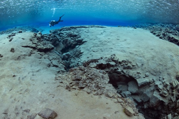Scuba diving in endless visability in Silfra fissure, Iceland
