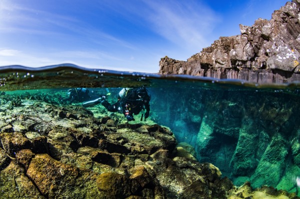 Scuba diving the continental divide in Bjarnagjá fissure, Iceland