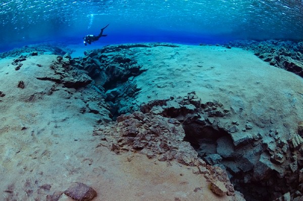 Scuba diving in endless visability in Silfra fissure, Iceland