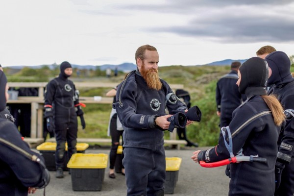 Gearing up in a dry suit, snorkel, fins and mask at Silfra