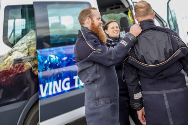 DIVE.IS getting ready for a guided snorkeling tour at Silfra fissure in Iceland